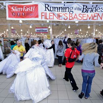 Participants of the Running of the Brides run in to Filene's Basement on May 20, 2011 in Columbus, Ohio. At Filene's Basement's Running of the Brides, Slim Fast, the brand known for helping millions of people slim down quickly, encouraged brides to get the perfect fit in the perfect dress. While waiting in line to rush the racks and purchase their dream dresses, Slim Fast entertained brides with fun bridal shower games. (Photo by Jamie Sabau/Getty Images for Slim-Fast)