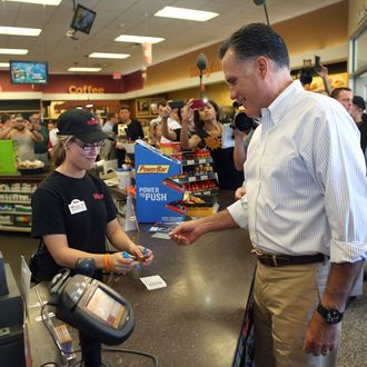 QUAKERTOWN, PA- JUNE 16: Republican Presidential candidate, former Massachusetts Gov. Mitt Romney prepares to pay for a sandwich in a WaWa Gas Station on June 16, 2012 in Quakertown, Pennsylvania. Mr. Romney continues hs campaign swing through battle ground states as he battles President Barack Obama for votes. (Photo by Joe Raedle/Getty Images)