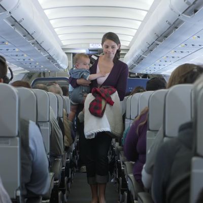 A mother and child, on an airplane
