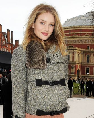 Rosie Huntington-Whiteley arrives at the Burberry Autumn Winter 2012 Womenswear Show during London Fashion Week at Kensington Gardens on February 20, 2012 in London, England.