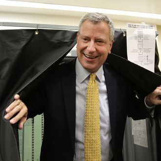 NEW YORK, NY - SEPTEMBER 10: Public Advocate and mayoral candidate Bill de Blasio emerges from a voting booth after voting in the New York City mayoral primary on September 10, 2013 in the Brooklyn borough of New York City. In recent polls by Quinnipiac University, de Blasio is now close to the 40 percent threshold he'd need to avoid a runoff in the Democratic primary. (Photo by Spencer Platt/Getty Images)