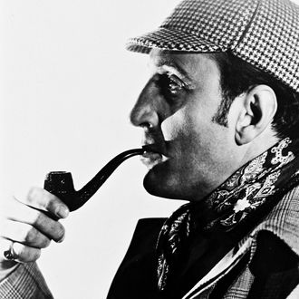 Basil Rathbone (1892-1967), British actor, wearing a deerstalker hat and smoking a pipe, in profile, in a studio portrait, against a white background, circa 1945. Rathbone played the character of 'Sherlock Holmes', created by Sir Arthur Conan Doyle (1859-1930), in a series of fourteen films. (Photo by Silver Screen Collection/Getty Images)