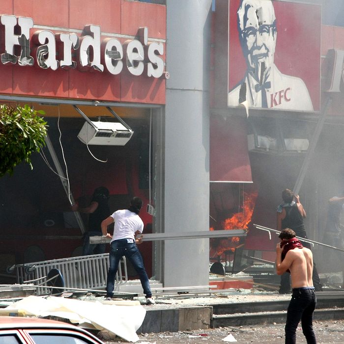 Lebanese men ransack US fast food chains Hardee's and KFC as they protest against the controversial film