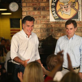 EVANSVILLE, IN - AUGUST 04: Republican presidential candidate and former Massachusetts Gov. Mitt Romney and U.S. Senate Candidate Richard Mourdock (R-IN) (R) greet supporters at a campaign event at Stepto's Bar B Q Shack on August 4, 2012 in Evansville, Indiana. Romney told supporters at the event that the latest jobs report was evidence that Obama’s economic policies were not working. (Photo by Scott Olson/Getty Images)