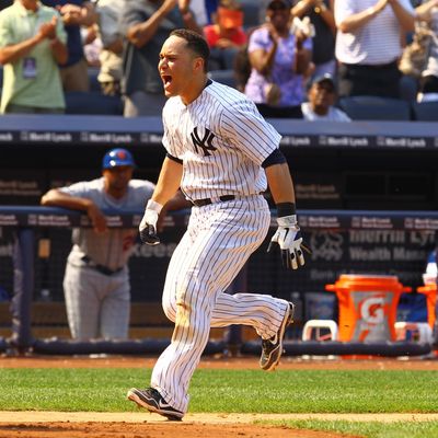 Russell Martin #55 of the New York Yankees celebrates his game winning walk off home run against the New York Mets defeating them 5-4 on June10, 2012 at Yankee Stadium in the Bronx borough of New York City.