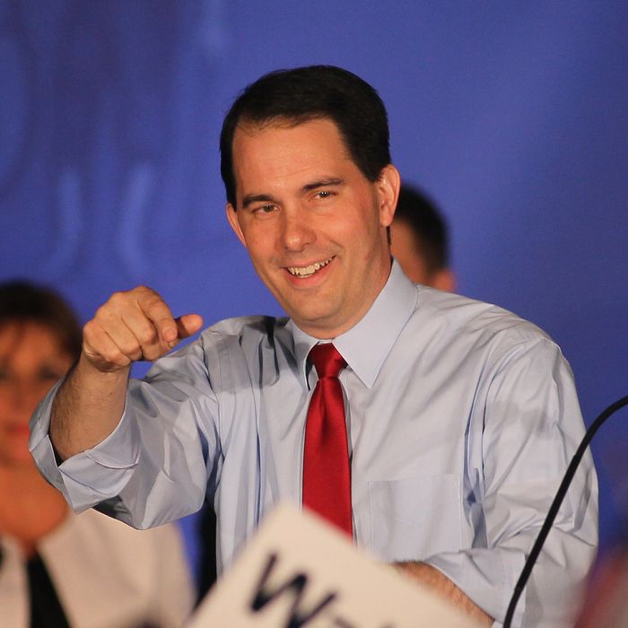 WAUKESHA, WI - JUNE 05: Wisconsin Governor Scott Walker greets supporters at an election-night rally June 5, 2012 in Waukesha, Wisconsin. Walker, only the third governor in history to face a recall election, defeated his Democrat contender Milwaukee Mayor Tom Barrett. Opponents of Walker forced the recall election after the governor pushed to change the collective bargaining process for public employees in the state. (Photo by Scott Olson/Getty Images)