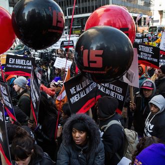 NEW YORK, NY - DECEMBER 04: Protesters march through the streets demanding a raise on the minimum wage to $15 per hour on December 4, 2014 in New York, United States. The movement, driven largely by fast food workers, has risen in prominence in the past year; today's protests were also joined by demonstrators angry at the Grand jury verdict to not indict the police officer who killed Eric Garner in July, 2014. (Photo by Andrew Burton/Getty Images)