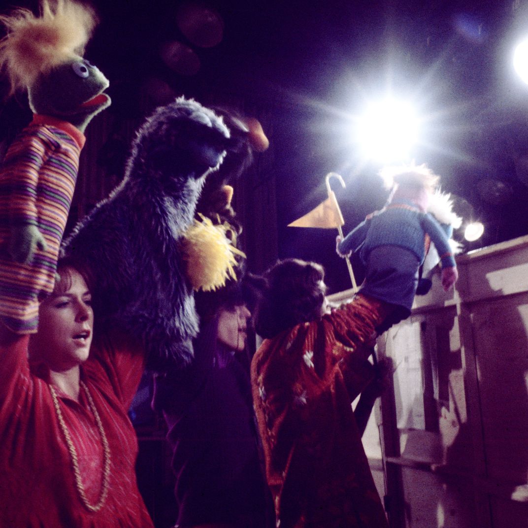 Muppet designer Caroly Wilcox works with puppeteers Jim Henson, Frank Oz, and Daniel Seagren.