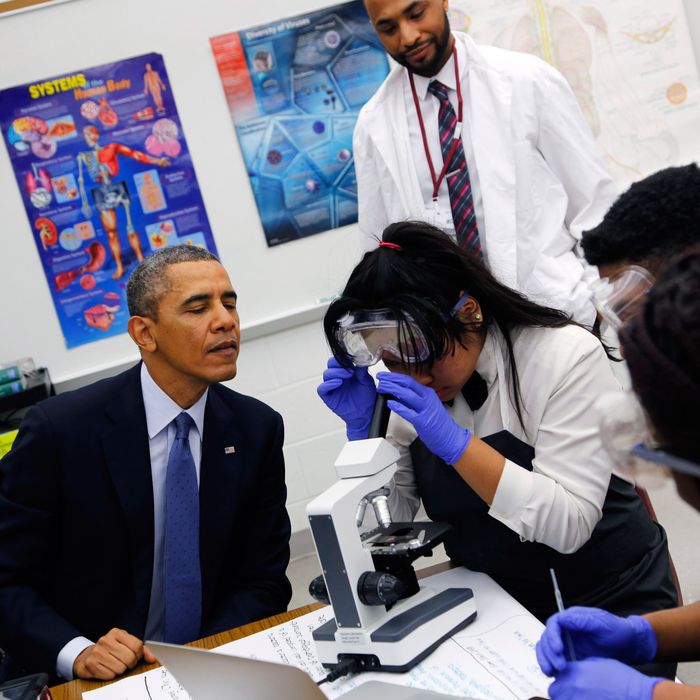 U.S. President Barack Obama visits with students in a 10th grade Microbiology class at Bladensburg High School April 7, 2014 in Bladensburg, Maryland. 