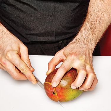 1. With a slicer, cut off bottom to create a “stand.”