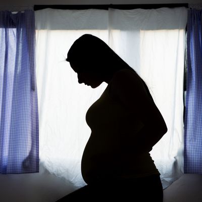 Pregnant woman at home