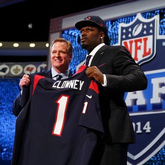 Jadeveon Clowney of the South Carolina Gamecocks stands on stage with NFL Commissioner Roger Goodell after he was picked #1 overall by the Houston Texansduring the first round of the 2014 NFL Draft at Radio City Music Hall on May 8, 2014 in New York City.