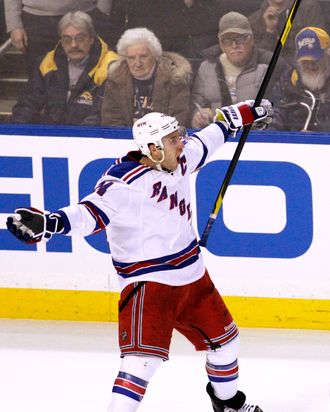 New York Rangers' Ryan Callahan (24) celebrates his game-winning goal on Buffalo Sabres goalie Ryan Miller during a shootout of an NHL hockey game in Buffalo, N.Y., Wednesday, Feb. 1, 2012.