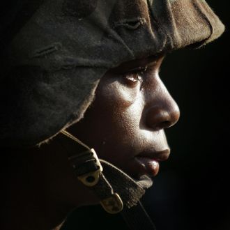PARRIS ISLAND, SC - JUNE 25: Female Marine Corps recruit Markeisha Richardson, 19, of St. Louis Missouri listens to instructions before going through urban warfare training at the United States Marine Corps recruit depot June 25, 2004 in Parris Island, South Carolina. Marine Corps boot camp, with its combination of strict discipline and exhaustive physical training, is considered the most rigorous of the armed forces recruit training. Congress is currently considering bills that could increase the size of the Marine Corps and the Army to help meet US military demands in Iraq and Afghanistan. (Photo by Scott Olson/Getty Images)