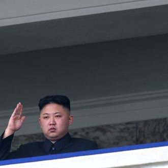 North Korean leader Kim Jong-Un salutes as he watches a military parade to mark 100 years since the birth of the country's founder and his grandfather, Kim Il-Sung, in Pyongyang on April 15, 2012. The commemorations came just two days after a satellite launch timed to mark the centenary fizzled out embarrassingly when the rocket apparently exploded within minutes of blastoff and plunged into the sea. AFP PHOTO / Ed Jones (Photo credit should read Ed Jones/AFP/Getty Images)