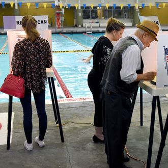 Rafael Sanchez, 90, and Michelle Green vote in the US presidential primary election June 7, 2016 at Echo Deep Pool in Los Angeles, California. 