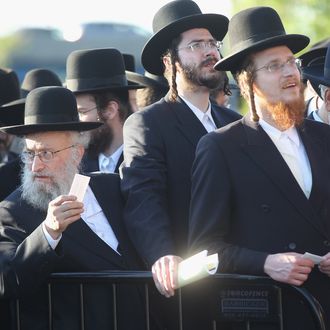Ultra-Orthodox Jews wait to enter Citi Field for a meeting to discuss the risks of using the Internet on May 20, 2012 in the Queens borough of New York City. More than 40,000 were expected to attend the rally at Citi Field, the home of the New York Mets, which organizers said would promote religiously responsible ways to use the Internet.