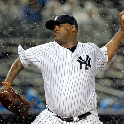 NEW YORK, NY - SEPTEMBER 30: CC Sabathia #52 of the New York Yankees pitches in the rain against the Detroit Tigers during Game One of the American League Division Series at Yankee Stadium on September 30, 2011 in the Bronx borough of New York City. (Photo by Chris Trotman/Getty Images)