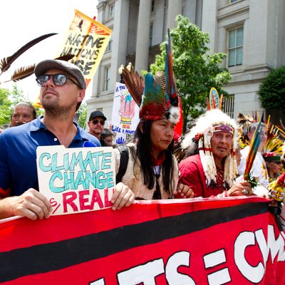 Leonardo DiCaprio Holds File Folder Sign at Climate March