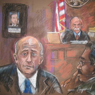 This court room sketch shows US Judge Michael Howell (R rear), with witness Lloyd Blankfein (L) and defendant ex-hedge fund tycoon Raj Rajaratnam on March 23, 2011 in New York. Goldman Sachs boss Lloyd Blankfein took to the stand Wednesday, telling jurors at a high-profile insider trading trial that one of Sachs ex-directors leaked sensitive company secrets. Blankfein admitted former Goldman director Rajat Gupta broke the firm's confidentiality rules by giving on-trial hedge fund manager Rajaratnam an inside take on the bank's possible acquisitions. AFP PHOTO/SHIRLEY SHEPARD (Photo credit should read SHIRLEY SHEPARD/AFP/Getty Images)