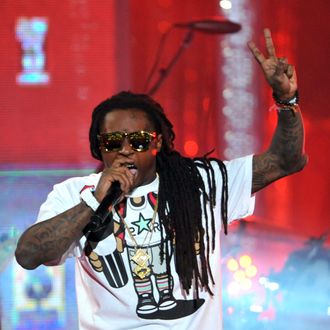 HOLLYWOOD, CA - MARCH 01: Rapper Lil Wayne performs onstage at Escape to Total Rewards at at Hollywood & Highland Center on March 1, 2012 in Hollywood, California. (Photo by Mark Davis/Getty Images for Caesars Entertainment)