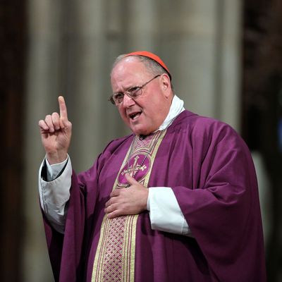 Cardinal Timothy Dolan, Archbishop of New York, addresses fellow Catholics at St. Patrick's Cathedral on Ash Wednesday on February 13, 2013 in New York City. Cardinal Dolan celebrated Mass and marked a cross with black ashes on the foreheads of Catholics, which marks the beginning of Lent, a 40-day period of pray and fasting for many Christians. Dolan is expected to travel to Rome in the next month to participate in the College of Cardinals, which will choose a successor to Pope Benedict XVI, who announded that he will step down as Pontiff.