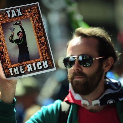 Occupy Wall Street participants take part in a protest to mark the movement's second anniversary in New York, September 17, 2013. Hundreds of Occupy Wall Street participants held a march to mark the movement's anniversary. 