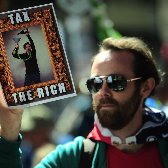 Occupy Wall Street participants take part in a protest to mark the movement's second anniversary in New York, September 17, 2013. Hundreds of Occupy Wall Street participants held a march to mark the movement's anniversary.