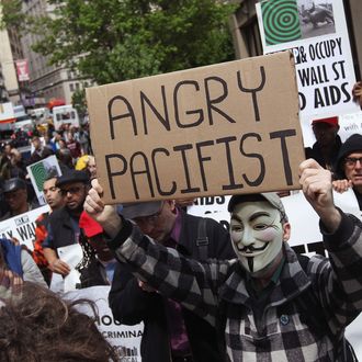 NEW YORK, NY - APRIL 25: Protesters march to Wall Street during an ACT-UP and Occupy Wall Street demonstration on April 25, 2012 in New York City. ACT-UP (AIDS Coalition to Unleash Power), was marking their 25-year anniversary in supporting services for people with AIDS worldwide. They were joined by Occupy Wall Street protesters in a march from New York's city hall to Wall Street. The groups called for a tax on Wall Street transactions and speculative trades to raise money for to end the global AIDS epidemic and provide universal healthcare in the U.S. (Photo by John Moore/Getty Images)