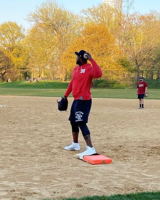 CC Sabathia playing first base in a softball game in Central Park.