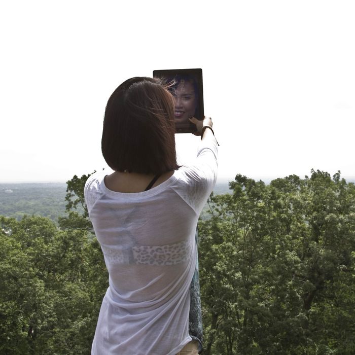 Young woman doing selfie.