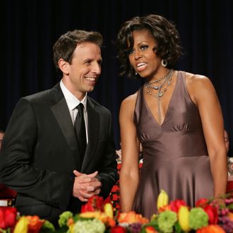 Seth Meyers of Saturday Night Live speaks with First Lady Michelle Obama at the White House Correspondents' Association annual dinner in Washington DC, April 30, 2011. AFP PHOTO / Chris KLEPONIS (Photo credit should read CHRIS KLEPONIS/AFP/Getty Images)