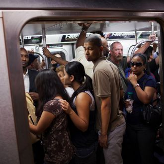 NEW YORK - AUGUST 23: People crowd into a full subway car August 23, 2011 in the Manhattan borough of New York. In 2010, New York's subway system delivered over 1.6 billion rides, averaging 5 million rides on weekdays, over three million on Saturdays and over two million on Sundays. (Photo by Robert Nickelsberg/Getty Images)