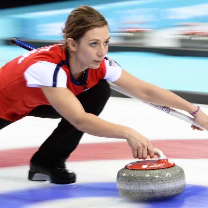 A woman curling.