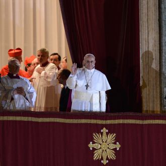 New Pope, Argentinian cardinal Jorge Mario Bergoglio appears at the window of St Peter's Basilica's balcony after being elected the 266th pope of the Roman Catholic Church on March 13, 2013 at the Vatican. 