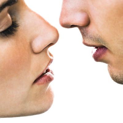 Man and woman, about to kiss.