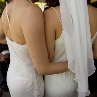 Two women embrace after getting married at city hall in San Francisco, California.