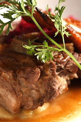 Juniper-braised lamb neck with puréed rutabaga, roasted carrots, and red sauerkraut.