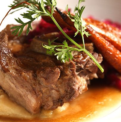 Juniper-braised lamb neck with puréed rutabaga, roasted carrots, and red sauerkraut.