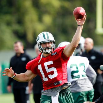 Tim Tebow #15 of the New York Jets works out at Jets Training Camp at SUNY Cortland on July 27, 2012 in Cortland, New York. 