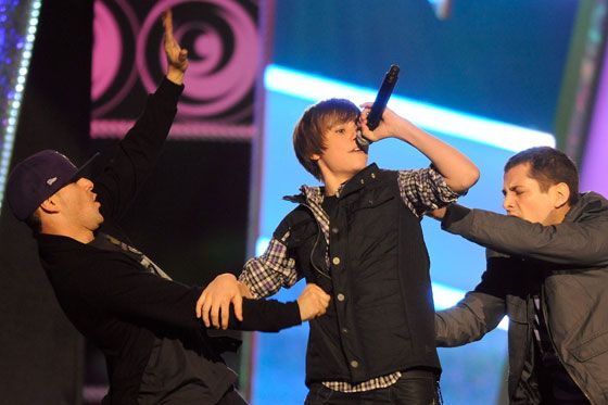 In this restorative move, Bieber's backup dancers faith-heal the injuries he sustained while attempting the David Lee Roth.