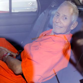 Robert Durst is transported from Orleans Parish Criminal District Court to the Orleans Parish Prison after his arraignment in New Orleans, Tuesday, March 17, 2015. Durst was rebooked on charges of being a convicted felon in possession of a firearm, and possession of a weapon with a controlled dangerous substance, a small amount of marijuana. (AP Photo/Gerald Herbert)