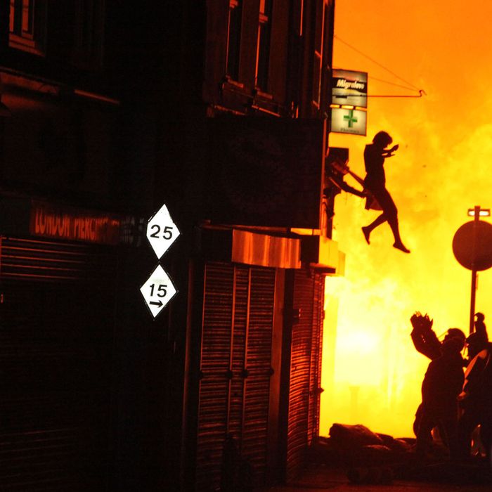 A woman can be seen jumping from a burning building in Surrey Street after rioting took place in Croydon, England on August 8, 2011.
Riots and looting have broken out all across Greater London and are now spreading across the country
following the shooting of Mark Duggan by police in Tottenham, North London on Friday, August 8th
London, England - 08.08.11
Mandatory Credit: WENN.com