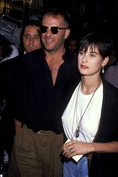 Penny for your thoughts, sullen guy over Bruce Willis's right shoulder?