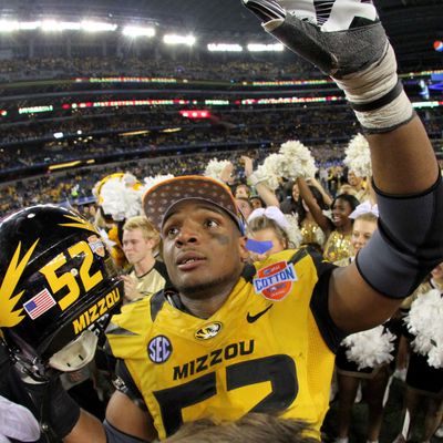 3 January 2014 - Missouri Tigers defensive end Michael Sam (#52) celebrates after the AT&T Cotton Bowl Classic matchup between the Missouri Tigers and Oklahoma State Cowboys at AT&T Stadium in Arlington, Texas. Missouri won the game 41-31.