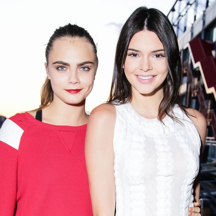 CARA DELEVINGNE and KENDALL JENNER at Chanel Metiers DArt 