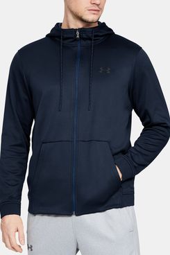 A warm and lightweight dark blue Under Armour Men’s Armour Fleece with a drawstring neck and a Full length-Zipper and a pair of Under Armour logo grey sweatpants on a male model. The Strategist - 33 Things on Sale You’ll Actually Want to Buy: From Adidas to Le Creuset