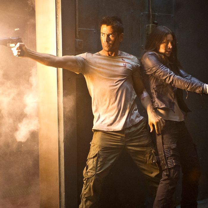 Colin Farrell (left) and Jessica Biel star in Columbia Pictures' action thriller TOTAL RECALL.