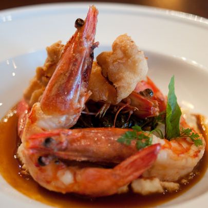 Shrimp and grits with chicken fried bacon.