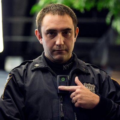 New York Police Department (NYPD) Officer Joshua Jones demonstrates how to use and operate a body camera during a press conference on December 3, 2014 in New York City. The NYPD is beginning a trial exploring the use of body cameras; starting Friday NYPD officers in three different precincts will begin wearing body cameras during their patrols. 